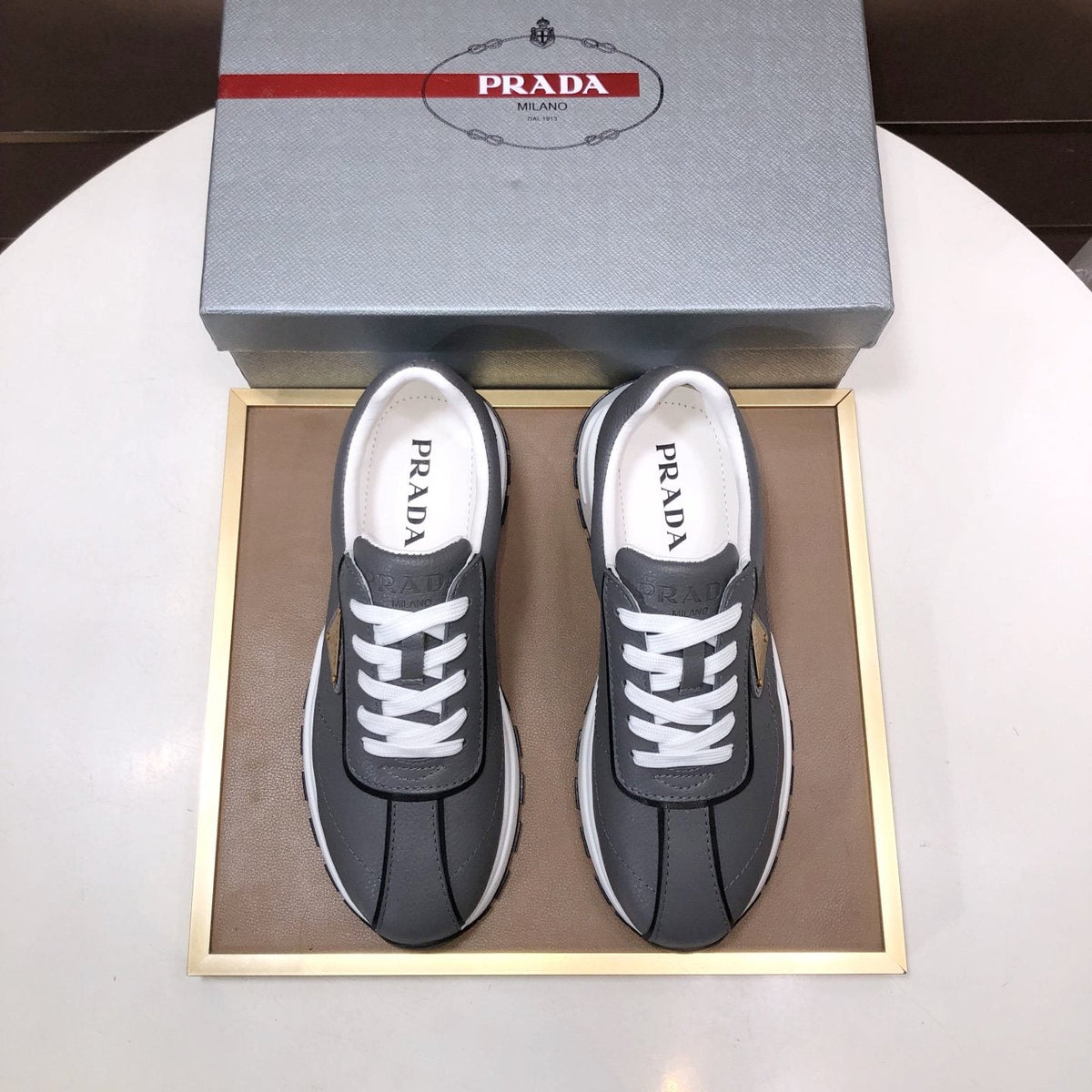 Prada Triangle Plaque Low-Top Sneakers - Triangular Side Plaque Detail